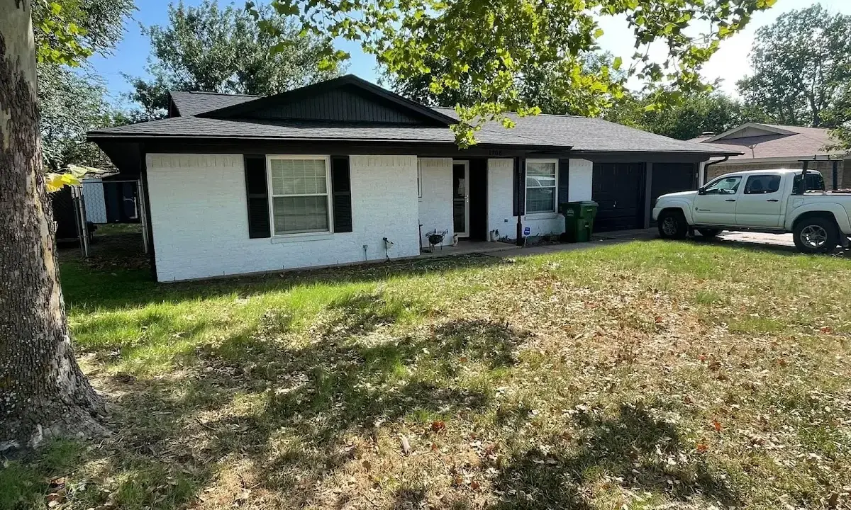 Professional roofing crew working on a residential roof in Fort Polk South